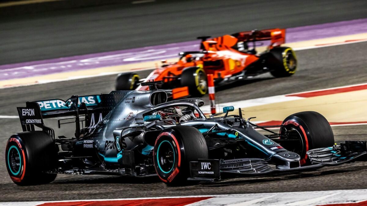 Lewis Hamilton (front) drives ahead of Ferrari's Sebastian Vettel during the Bahrain Grand Prix on Sunday.