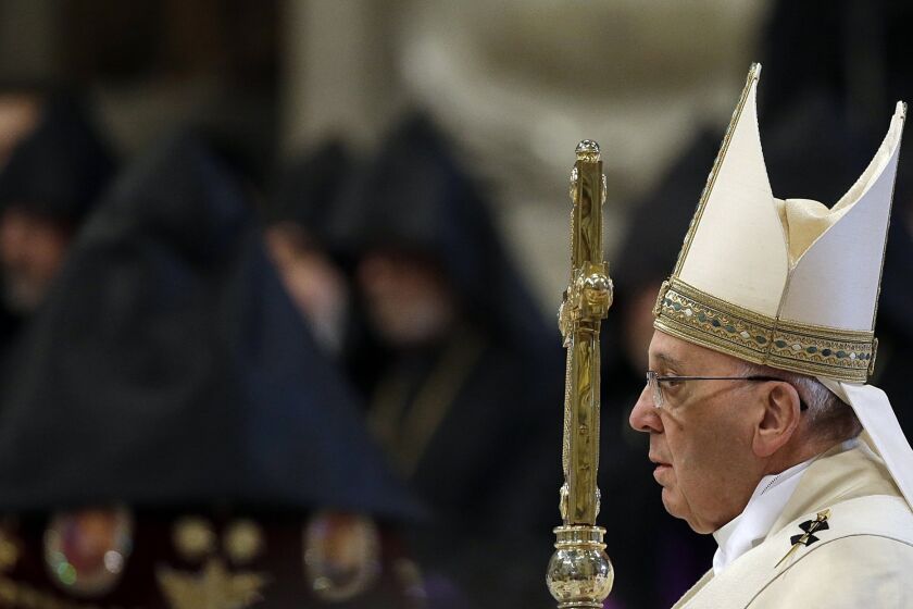 Pope Francis arrives in St. Peter's Basilica at the Vatican to preside over an Armenian rite Mass on April 12.