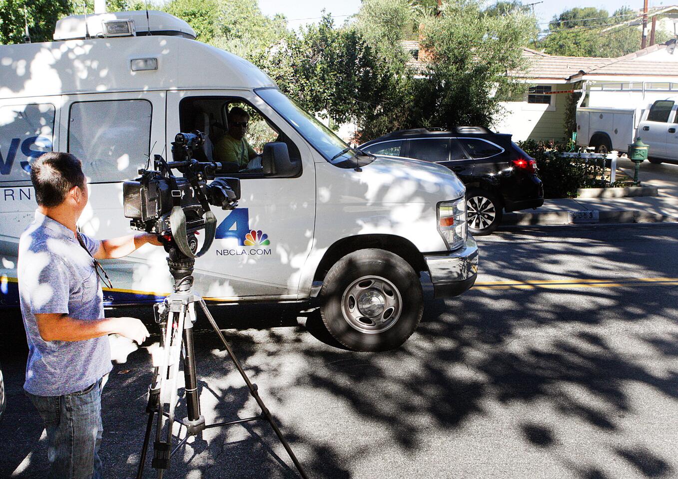 News media, preparing to set up for the rest of the day until the 6:00 P.M. news, position across the street from the scene of a murder-suicide on the 5000 block of Crown Avenue in La Canada Flintrdige on Monday, September 7, 2015. Last night, a Los Angeles County Firefighter shot and killed his Los Angeles County Sheriff's Department wife, then killed himself.