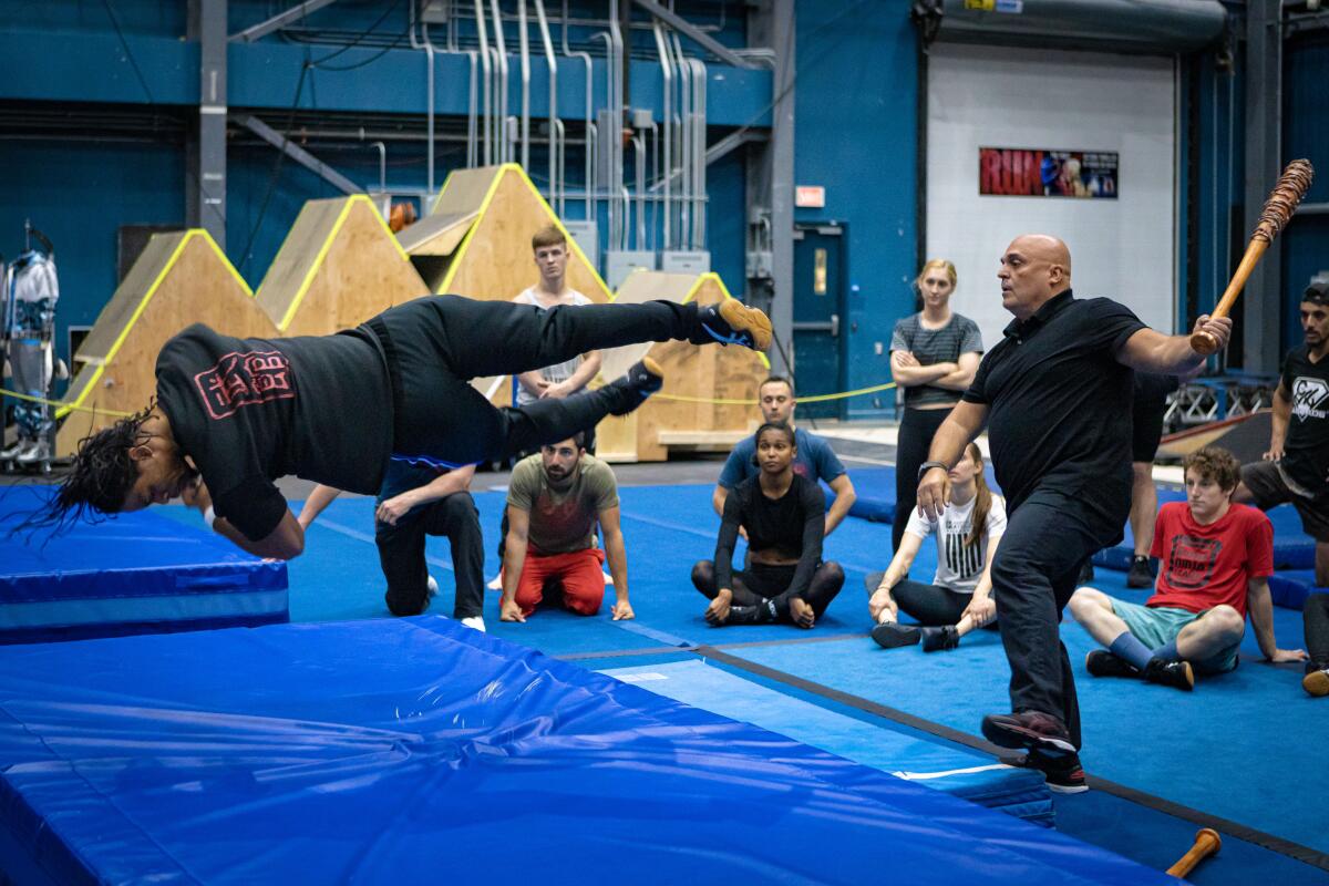 "R.U.N" cast members go through fight stunts with Jean Frenette during a Cirque preview in Montreal. 