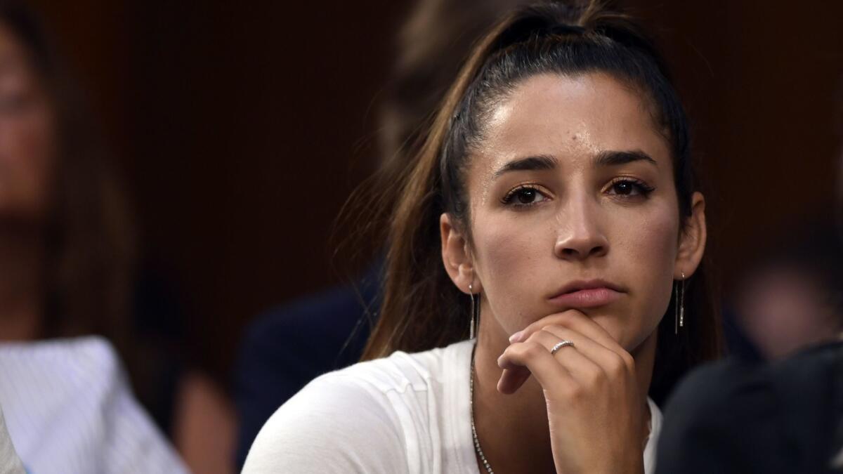 Olympic gold medalist Aly Raisman listens to testimony during a Senate subcommittee hearing on July 24.