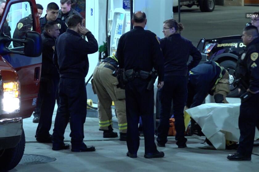 Paramedics transported two people who showed up with gunshot wounds at a gas station in National City early Tuesday.