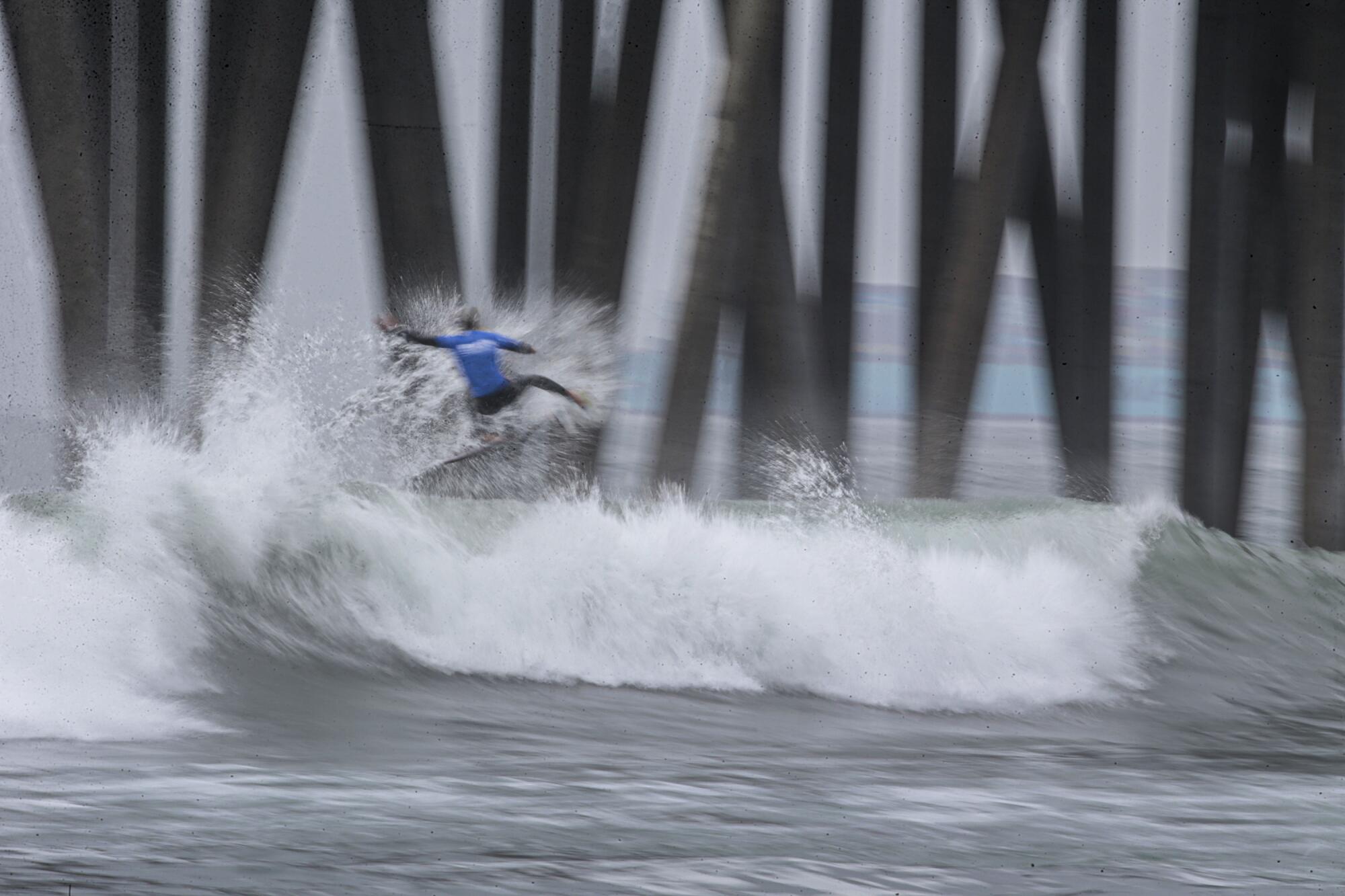 Kanoa Igarashi competes in a quarterfinal heat at the US Open of Surfing