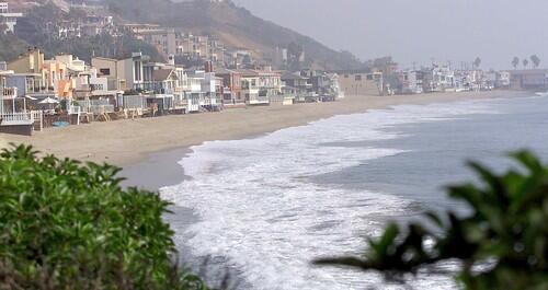 An unidentified buyer has purchased two beachfront lots on Malibu's Carbon Beach for $24.95 million.