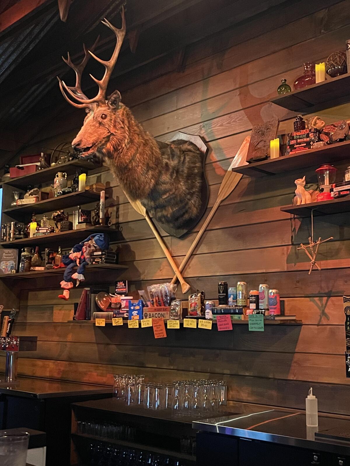 Slashers Axe Throwing & Ales recreates a cabin-in-the-woods decor.