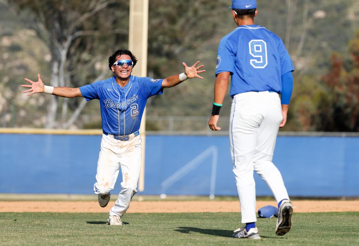 Rancho Bernardo's Hugo Gonzalez and Theo Kim celebrate beating Cathedral Catholic.