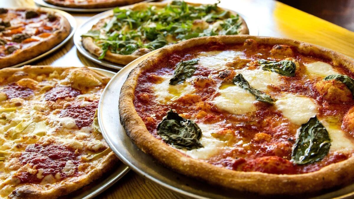 Personal 11-inch pizzas are the mainstay of Blaze Pizza’s menu. The chain is branching out, offering 14-inch pizzas for delivery.