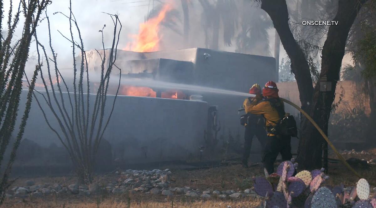 A brush fire that tore through a south Riverside neighborhood, destroying homes and consuming more than 500 acres.