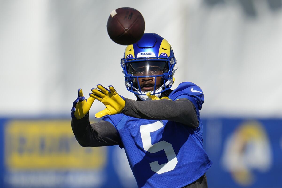 Rams wide receiver Tutu Atwell makes a catch during training camp in July.