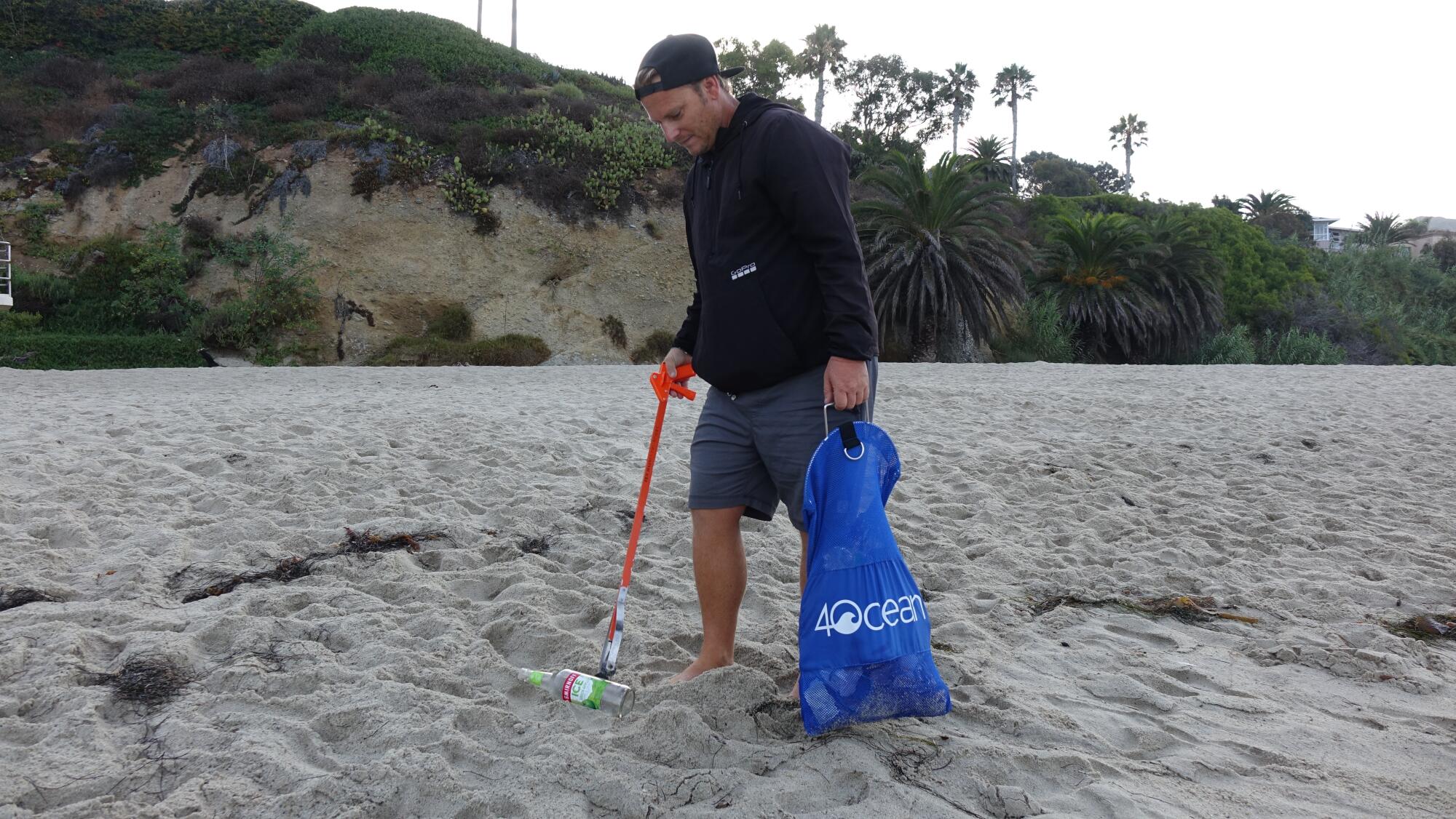 Greg Viviani picks up trash in Laguna Beach. 