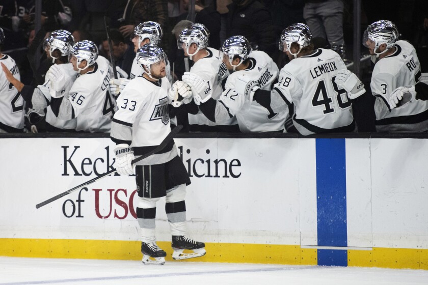 The Kings' Viktor Arvidsson (33) is congratulated after his first-period goal against the Ottawa Senators on Nov. 27, 2021.