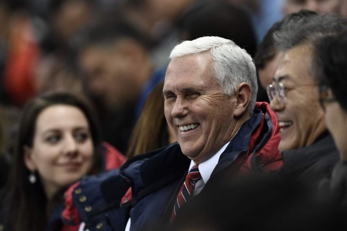Vice President Mike Pence sits with South Korean President Moon Jae-in during the short track speedskating.