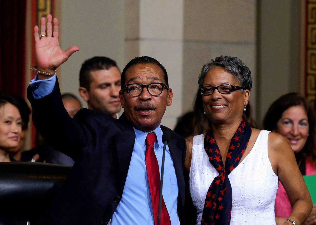 Herb Wesson, shown with his wife, Fabian Wesson, acknowledges applause after being reelected L.A. City Council president.