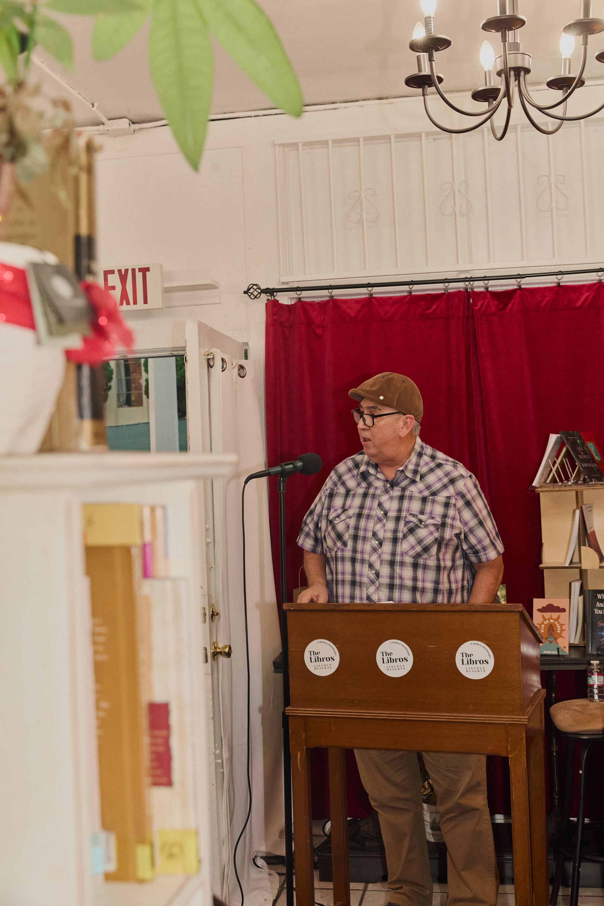 Donato Martinez reads his poetry at the Libros Lincoln Heights bookshop.