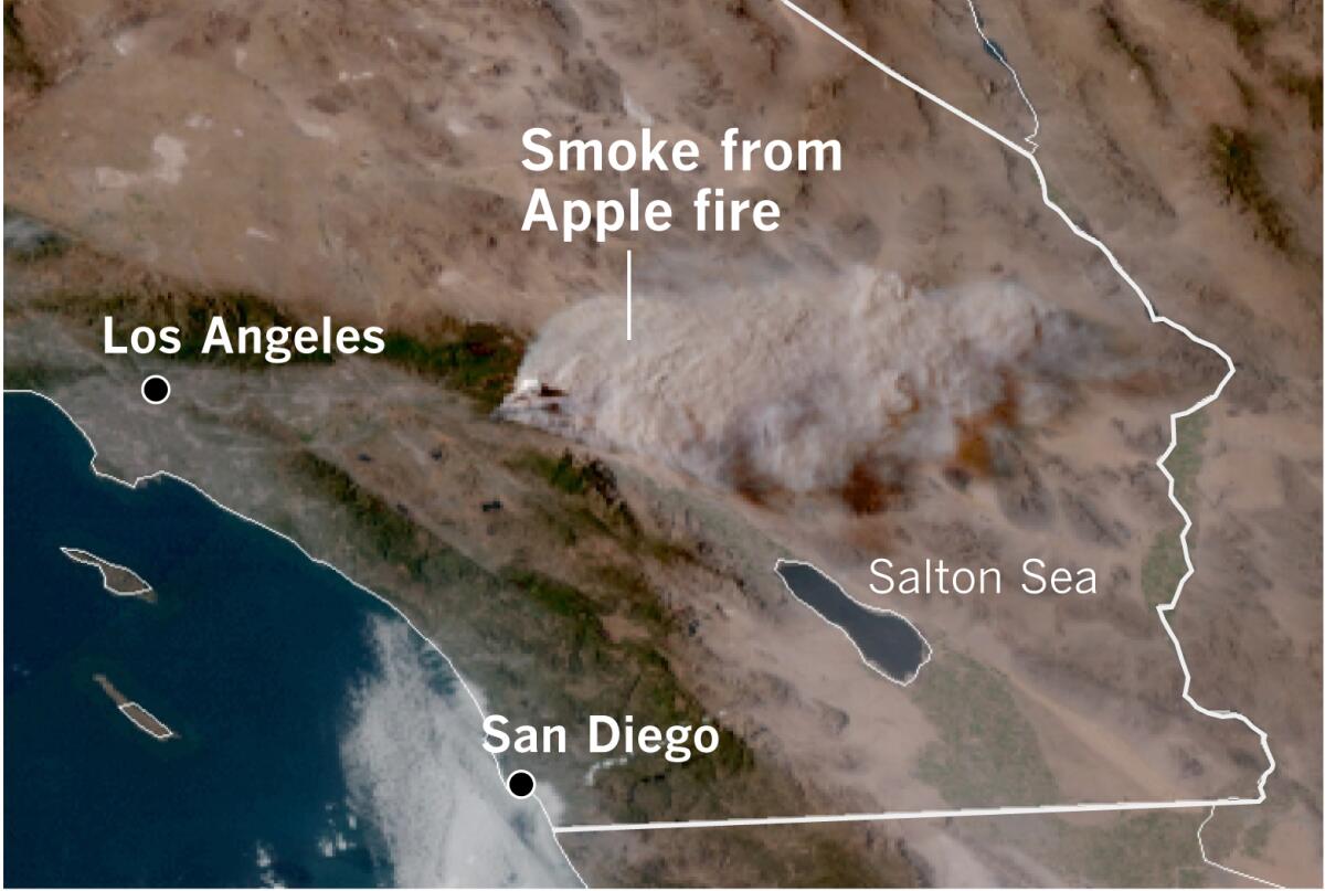A satellite image shows the pyrocumulus plume from the Apple fire rising about 32,000 feet into the atmosphere