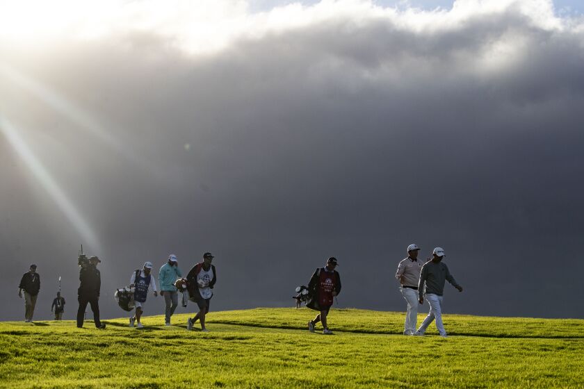 La Jolla, CA - January 28: Golfers walk down the fairway of the 16th hole during the final round of the 2023 Farmers Insurance Open at Torrey Pines Golf Course on Saturday, Jan. 28, 2023 in La Jolla, CA.