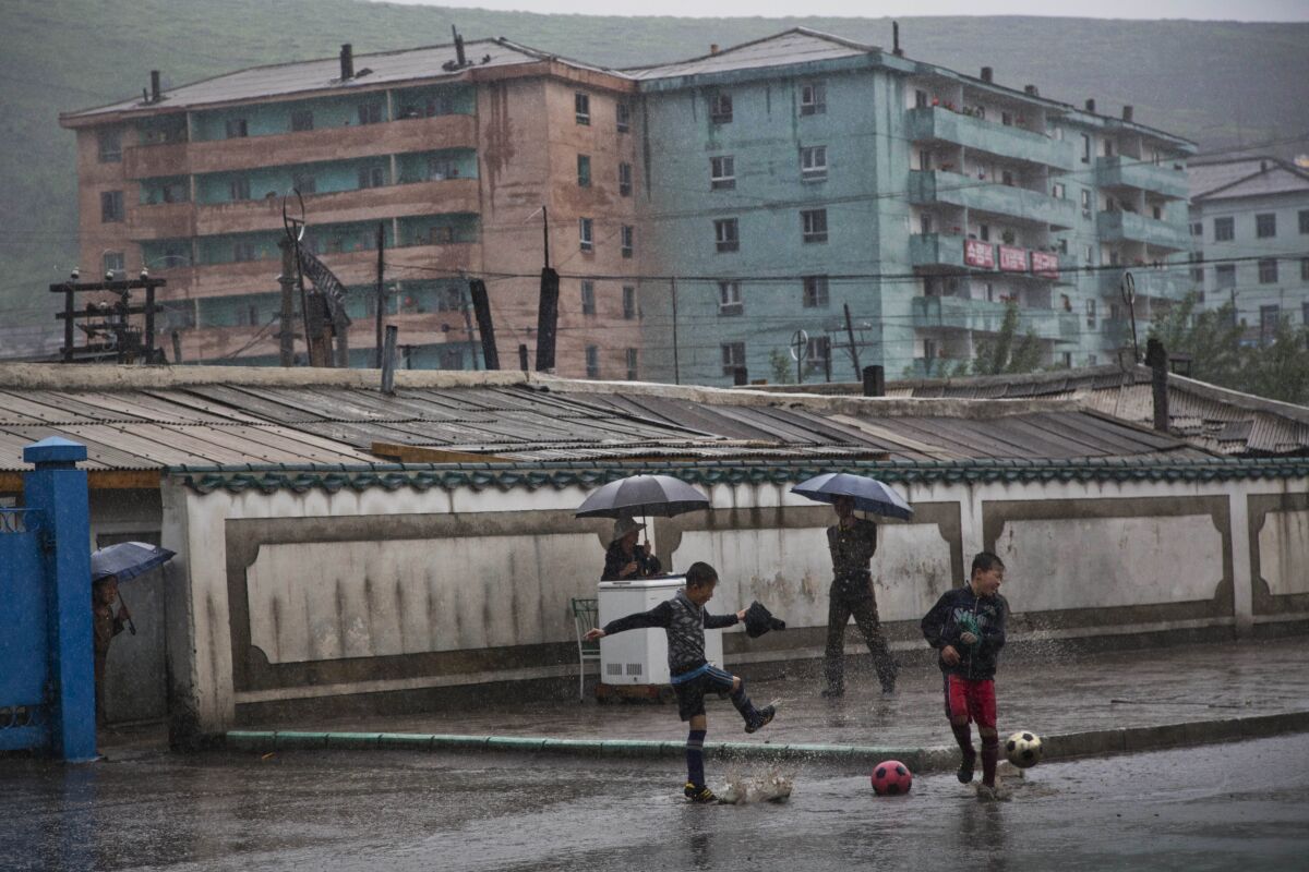Boys play soccer in Hyesan, North Korea, in 2014.
