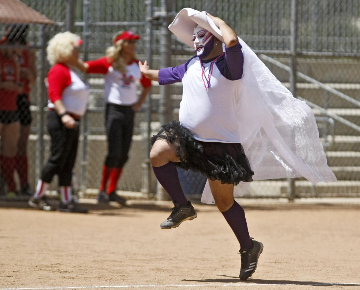 Sister Bearonce, of the L.A. Sisters of Perpetual Indulgence, skips home after a teammate hit a home run during the 3rd annual Drag Queen Softball World Series vs. the West Hollywood Cheerleaders softball team at the Glendale Sports Complex in Glendale on Saturday, May 10, 2014.