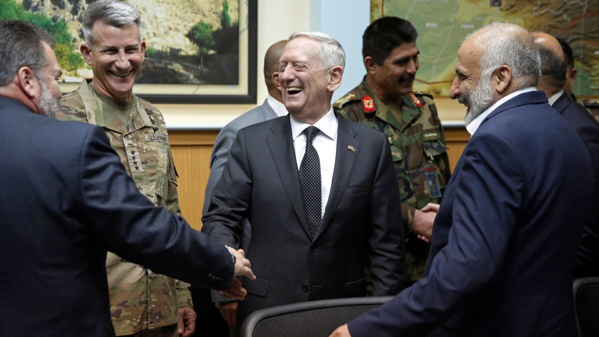 Defense Secretary James Mattis, center, and Army Gen. John Nicholson, commander of U.S. forces in Afghanistan, second from left, meet with Afghanistan's National Security Director Mohammad Masoom Stanekzai, right, in Kabul, Afghanistan on April 24, 2017.