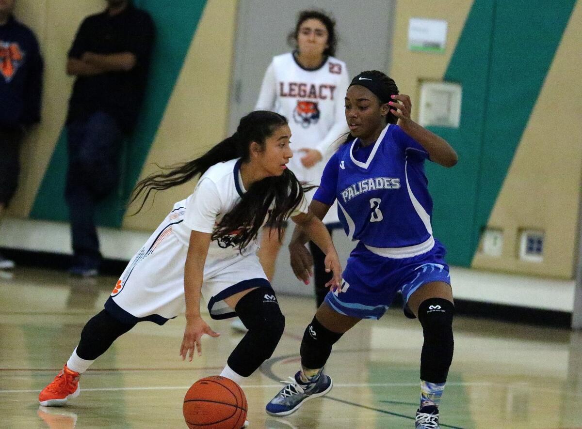 South Gate Legacy point guard Jennifer Pool probes the defense in a 65-62 win over Palisades in the Legacy Tournament.