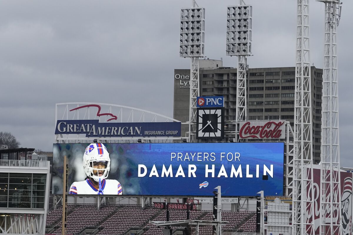 A scoreboard at Great American Ball Park in Cincinnati displays a photo of Buffalo Bills' Damar Hamlin.