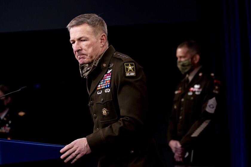 Gen. James McConville, Chief of Staff of the Army, left, accompanied by Sergeant Major of the Army Michael A. Grinston.