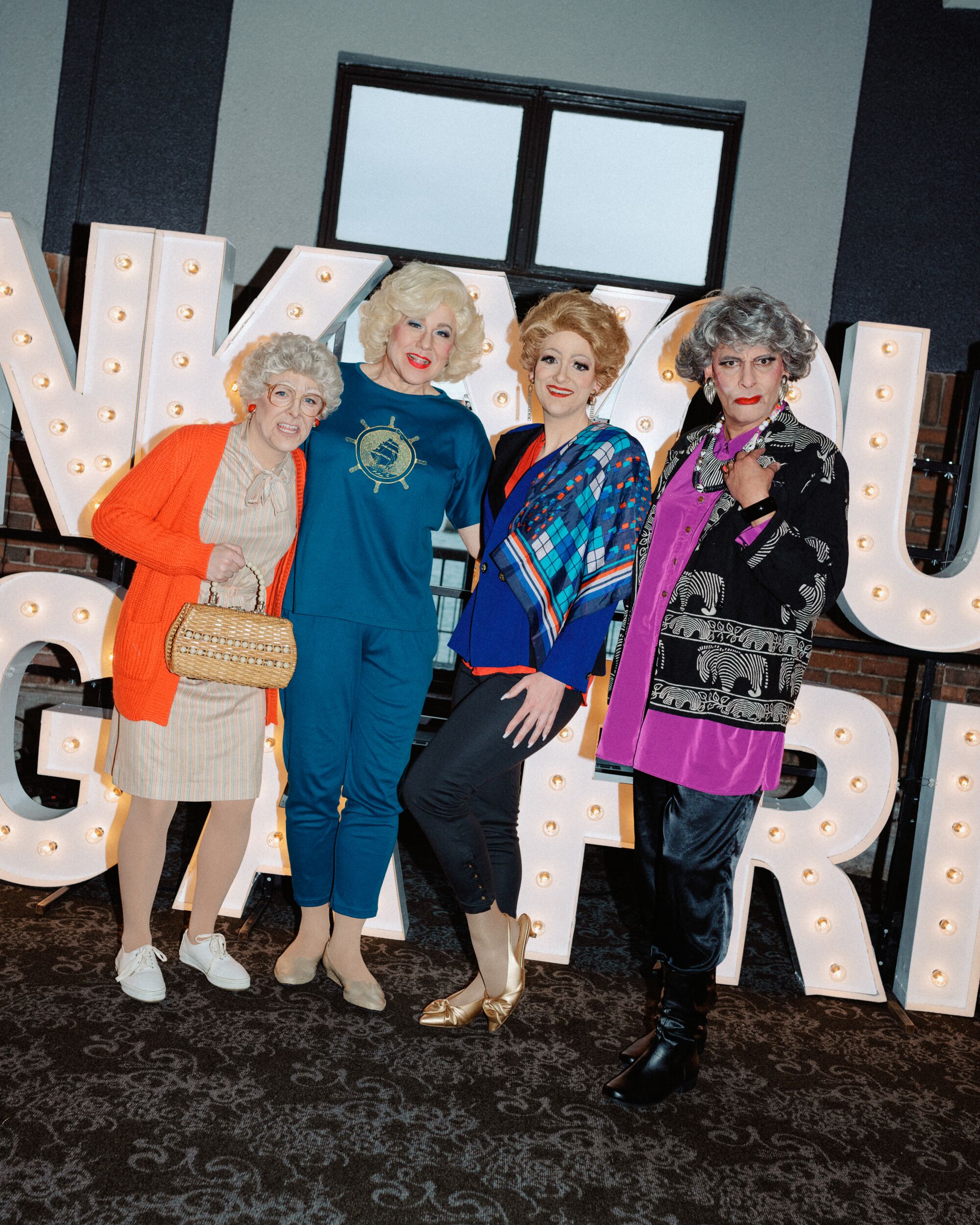 Four people in drag dressed as "Golden Girls" characters.