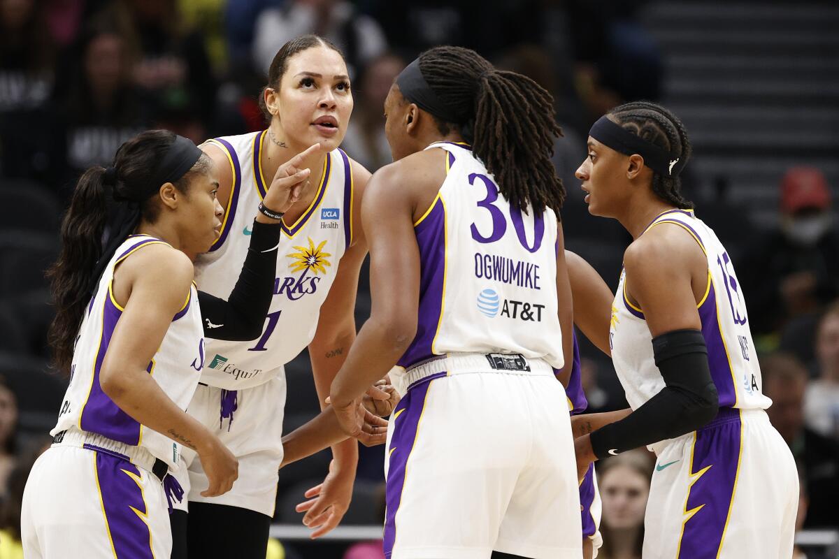 The Sparks huddle during game against the Seattle Storm.