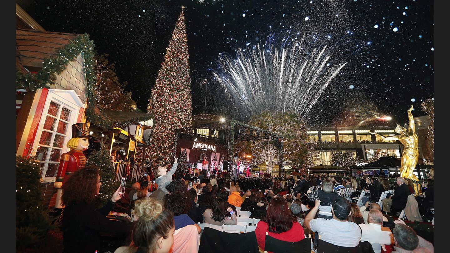 The Christmas Tree is lit with fireworks and soapy snow at the annual Christmas tree lighting at the Americana at Brand in Glendale on Thursday, November 16, 2017. A couple thousand people surrounded the fountain pool, with an audience of special guests seated in front for the Christmas-themed performance.