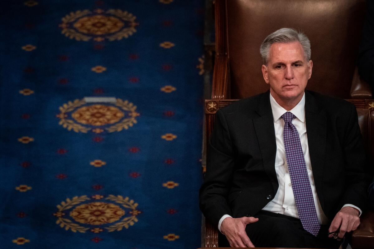Rep. Kevin McCarthy sitting glumly in the House chamber