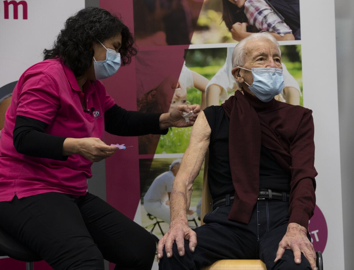 Jos Bieleveldt, 91, receives a COVID-19 vaccine in Apeldoorn, the Netherlands.