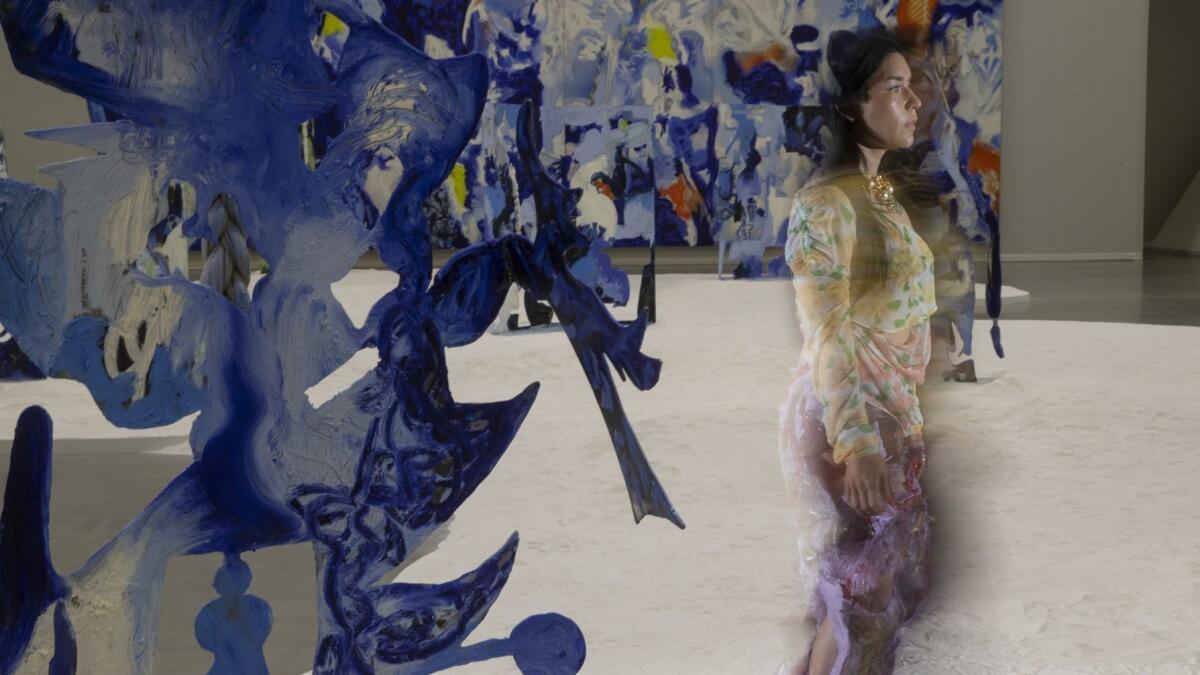 Artist Donna Huanca walks through her installation at the Marciano Art Foundation.