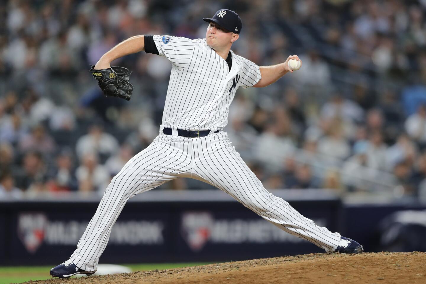NEW YORK, NEW YORK - OCTOBER 03: Zach Britton #53 of the New York Yankees throws a pitch against the Oakland Athletics during the eighth inning in the American League Wild Card Game at Yankee Stadium on October 03, 2018 in the Bronx borough of New York City. (Photo by Elsa/Getty Images) ** OUTS - ELSENT, FPG, CM - OUTS * NM, PH, VA if sourced by CT, LA or MoD **