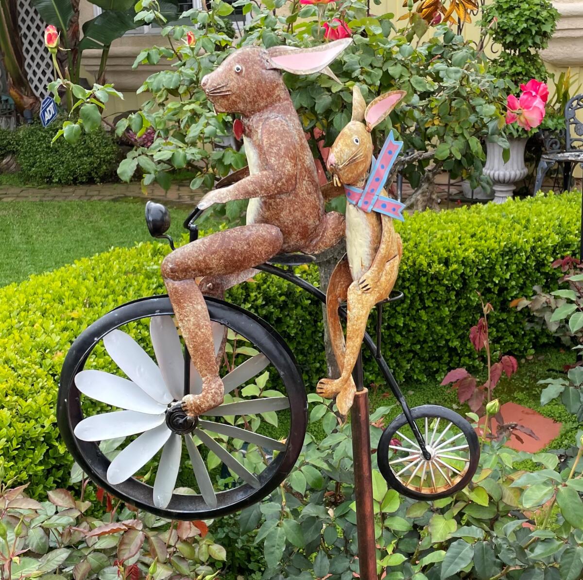 Bike-riding bunnies add a sense of fun to this backyard.