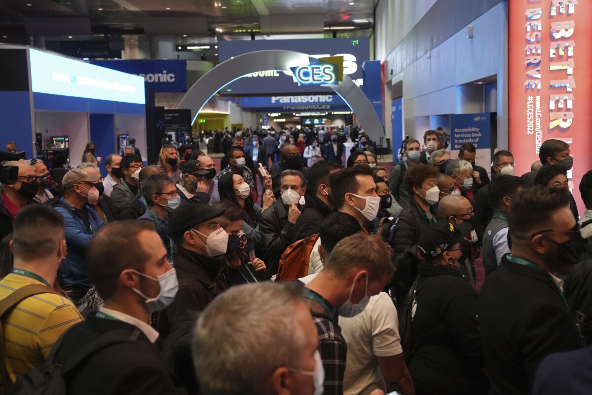 A crowd waits to enter the main show floor at the CES tech show Wednesday, Jan. 5, 2022, in Las Vegas. (AP Photo/Joe Buglewicz)