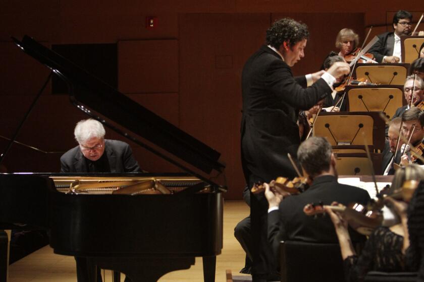 Emanuel Ax plays piano as Gustavo Dudamel conducts L.A. Philharmonic during the concert.