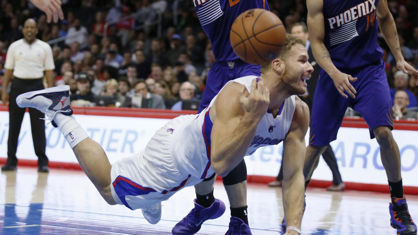 Clippers power forward Blake Griffin tosses the ball after being called for traveling during a 120-107 win over the Phoenix Suns at Staples Center on Saturday.