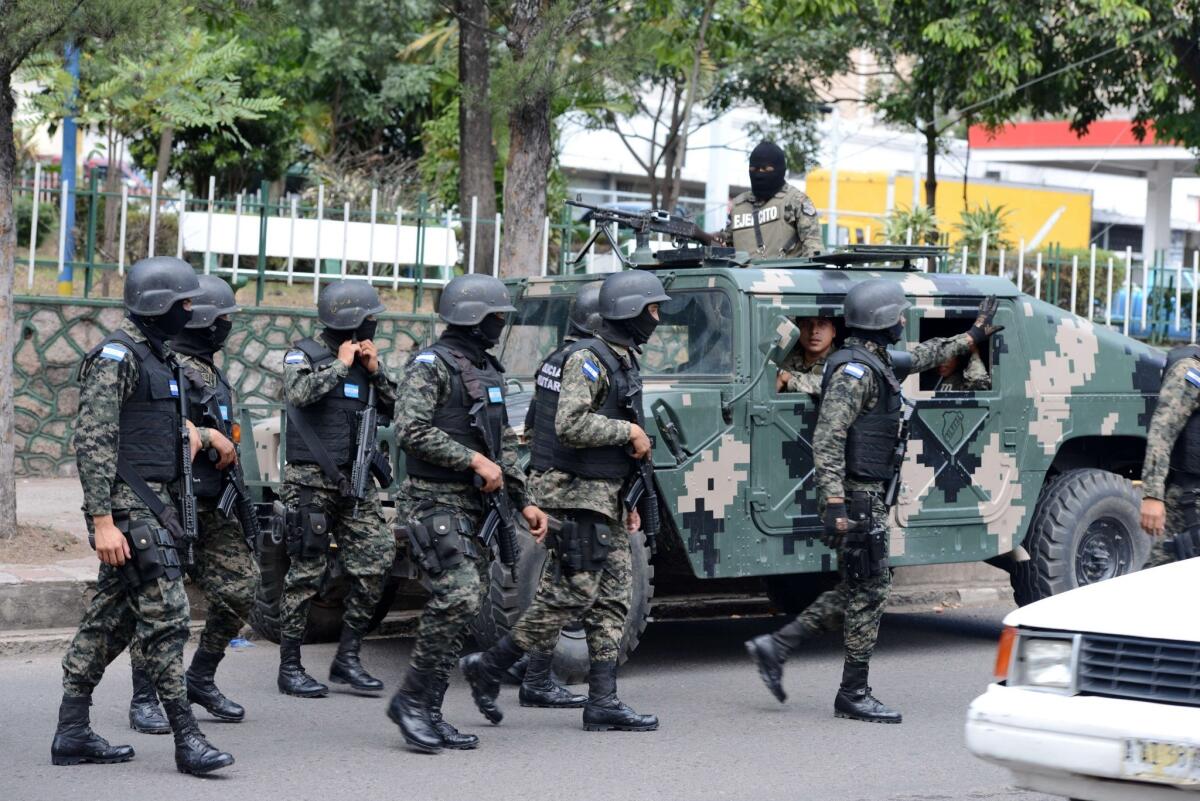 Soldiers patrol the streets of Tegucigalpa, Honduras, during the launch of an anti-violence operation.
