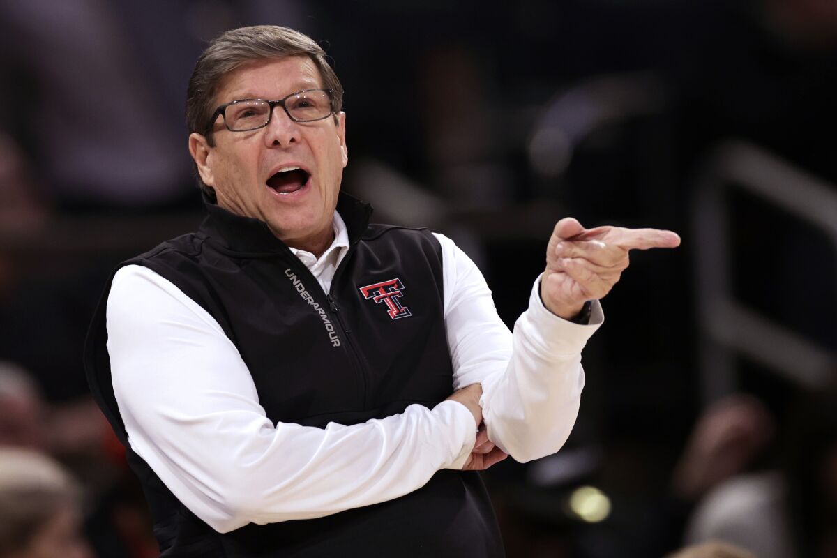 FILE - Texas Tech coach Mark Adams gestures during the first half of an NCAA college basketball game against Tennessee in the Jimmy V Classic, Dec. 7, 2021, in New York. Adams' 25th-ranked Red Raiders are starting a three-game stretch against No. 11 Iowa State, No. 6 Kansas and No. 1 Baylor. (AP Photo/Adam Hunger, File)
