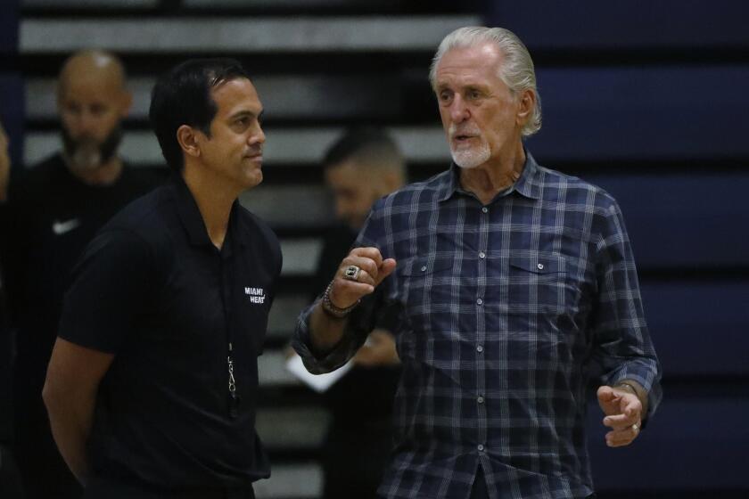 Miami Heat head coach Erik Spoelstra, left, talks with president Pat Riley during the team's NBA basketball practice at Keiser University, Tuesday, Oct. 1, 2019, in West Palm Beach, Fla. (AP Photo/Wilfredo Lee)