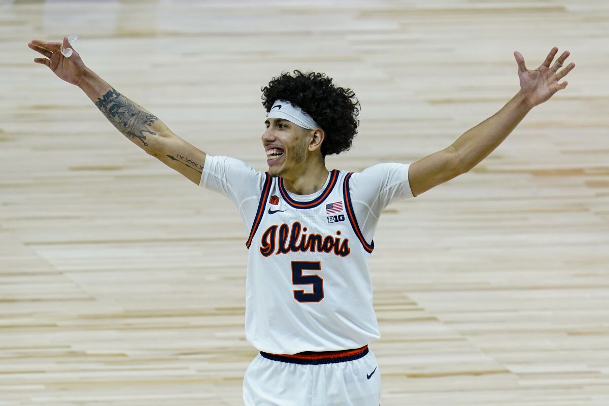 Illinois guard Andre Curbelo celebrates after defeating Ohio State in the Big Ten tournament championship.