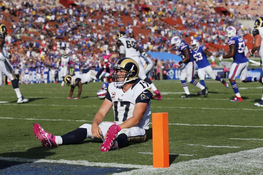 Rams quarterback Case Keenum (17) sits on the ground after being sacked by Buffalo Bills outside linebacker Lorenzo Alexander (57) on the Rams last offensive possession of the game in a 30-19 loss to the Bills.