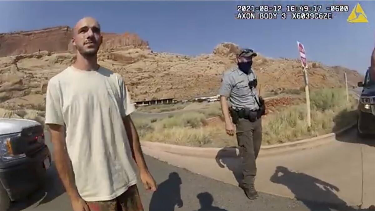 An image from police video shows Brian Laundrie talking to a police officer.
