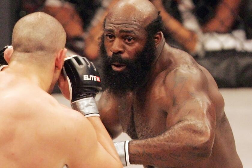 In this May 31, 2008, file photo, Kimbo Slice, right, battles James Thompson of Manchester, England during their EliteXC heavyweight bout at the Prudential Center in Newark, N.J.