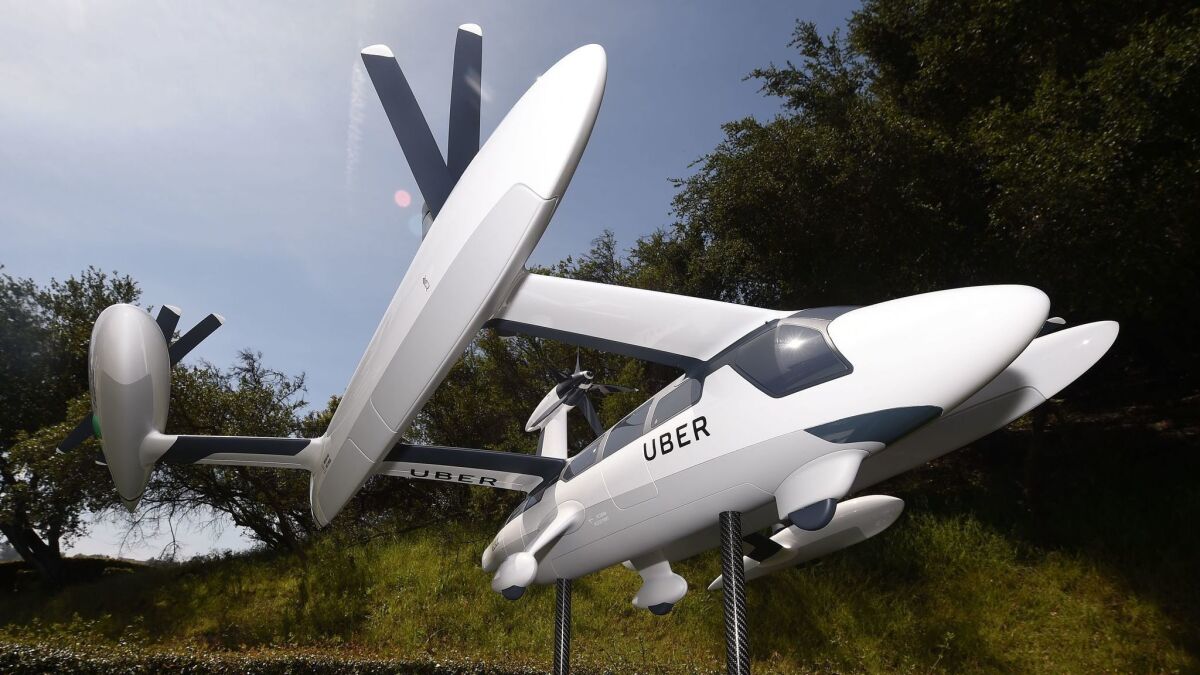 A model of Uber's flying taxi concept on display at the Uber Elevate Summit in Los Angeles in May.