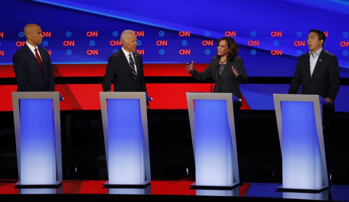 From left, Sen. Cory Booker, former Vice President Joe Biden, Sen. Kamala Harris and Andrew Yang.
