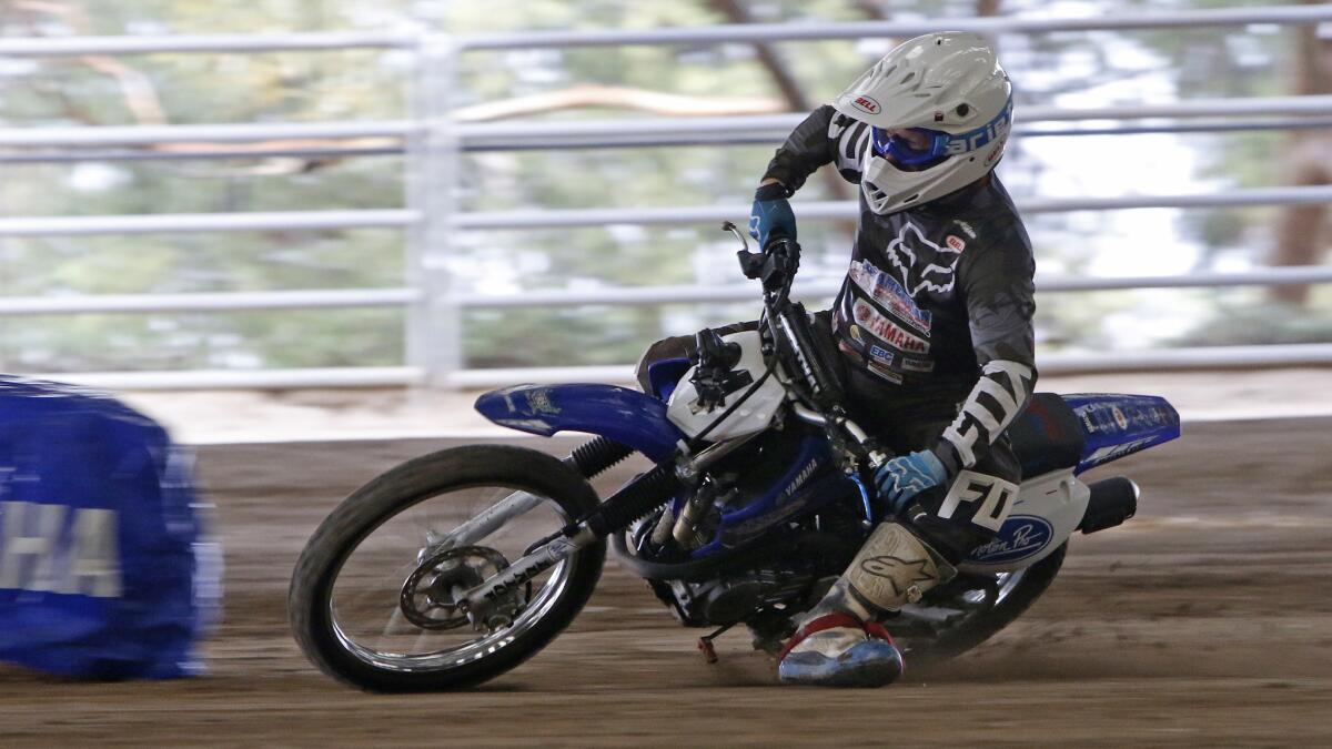 Chris Carr, seven-time winner of the Grand National Championships, demonstrates race techniques as part of American Supercamp Motorcycle Technique School at the Industry Hills Expo Center.