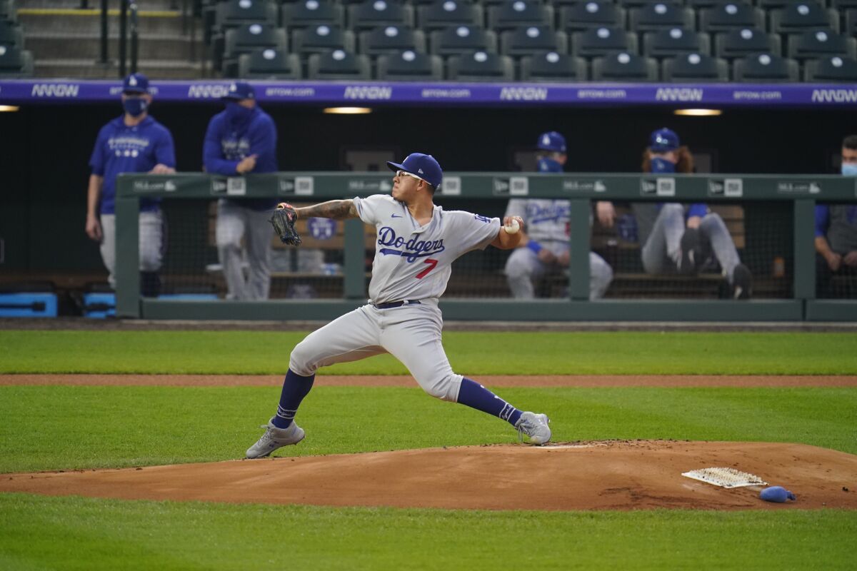 Dodgers pitcher Julio Urías pitches against the Colorado Rockies last month.