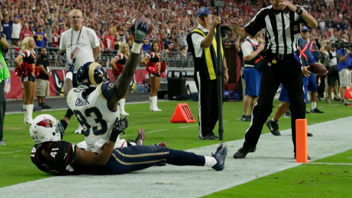 Rams receiver Brian Quick holds up the ball after catching a four-yard touchdown pass against the Cardinals on Oct. 2.