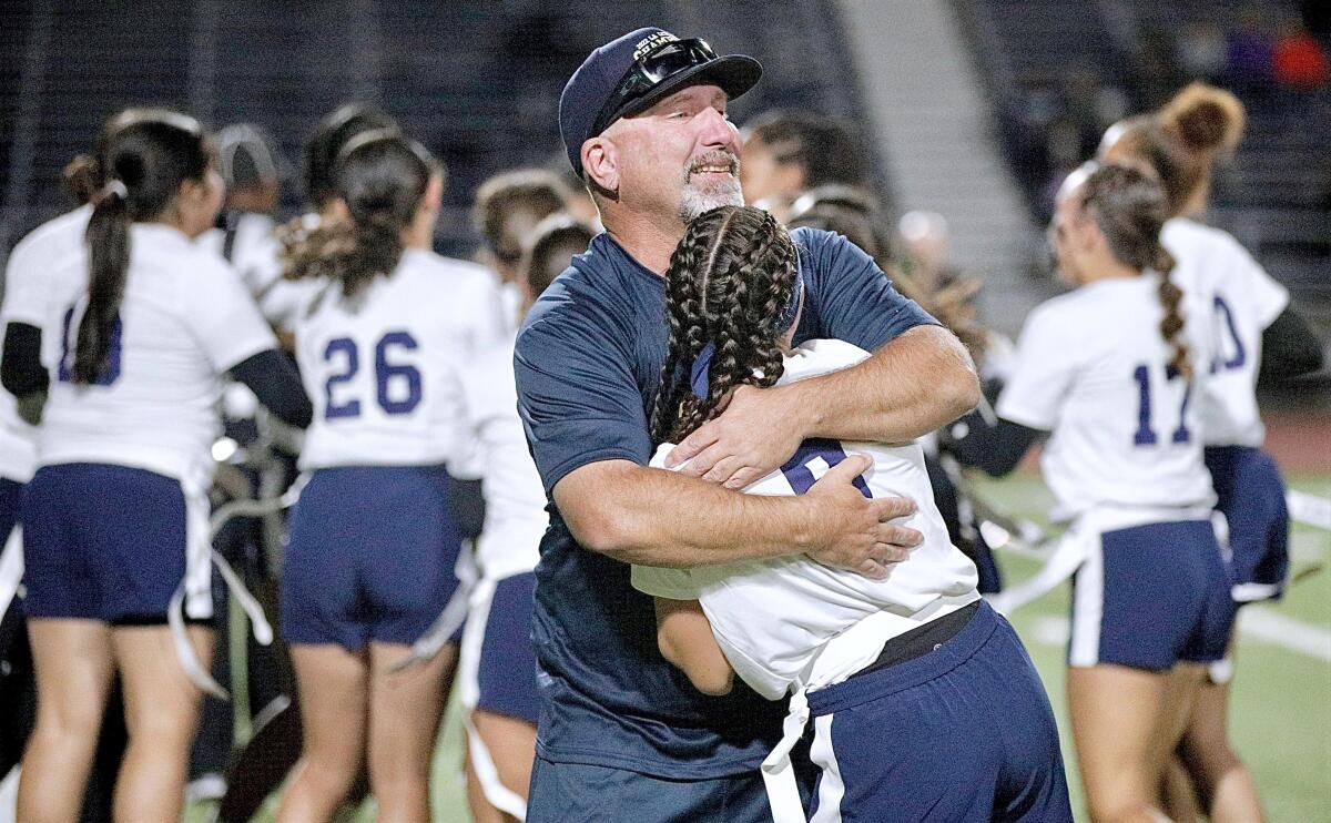 Birmingham coach Jim Rose hugs his daughter Jessica after a 14-6 victory over San Pedro.